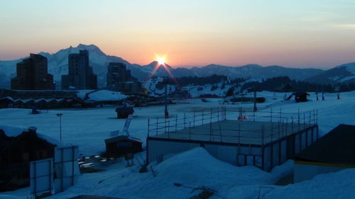 Scenic view of frozen lake against sky during sunset