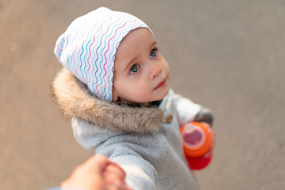 Cute girl standing at park during winter