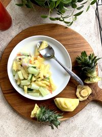 Healthy and delicious tropical salad, using pinnaple, cucumber, onion, chili, salt and honey