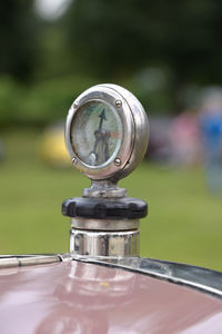 Close-up of vintage car on grass