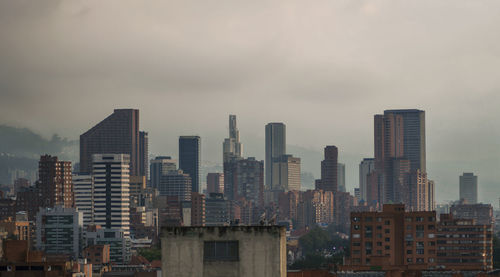 Cityscape against sky at dusk