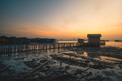 Scenic view of sea against orange sky