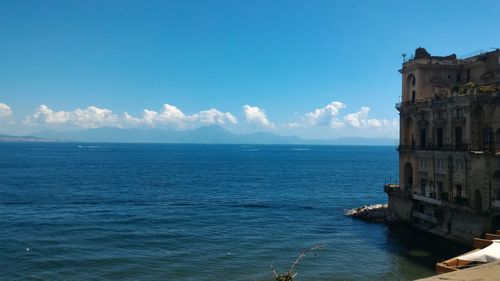 Scenic view of sea against blue sky