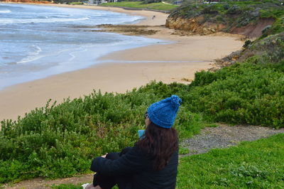 Rear view of woman on beach