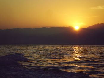 Scenic view of sea against sky during sunset