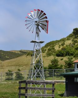Traditional windmill on landscape