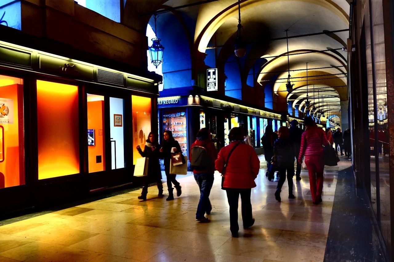 indoors, architecture, built structure, low angle view, illuminated, lighting equipment, building exterior, orange color, transportation, mode of transport, building, steps, yellow, railing, steps and staircases, staircase, high angle view, lantern, no people, wall - building feature