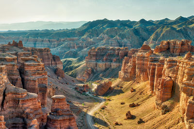 Aerial view of landscape with mountain range in background