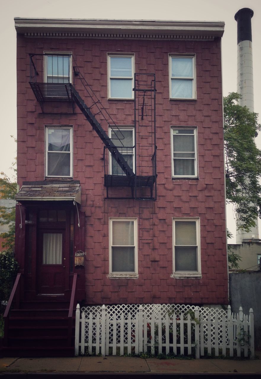 architecture, building exterior, built structure, window, building, residential building, residential structure, house, low angle view, day, facade, outdoors, brick wall, exterior, old, no people, city, door, railing, wall - building feature
