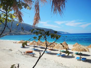 Scenic view of beach against blue sky