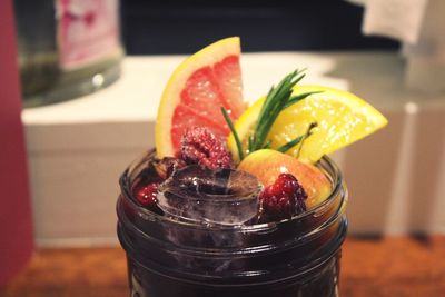 Close-up of fruits in glass on table