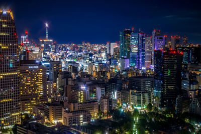 High angle view of illuminated buildings in city at night