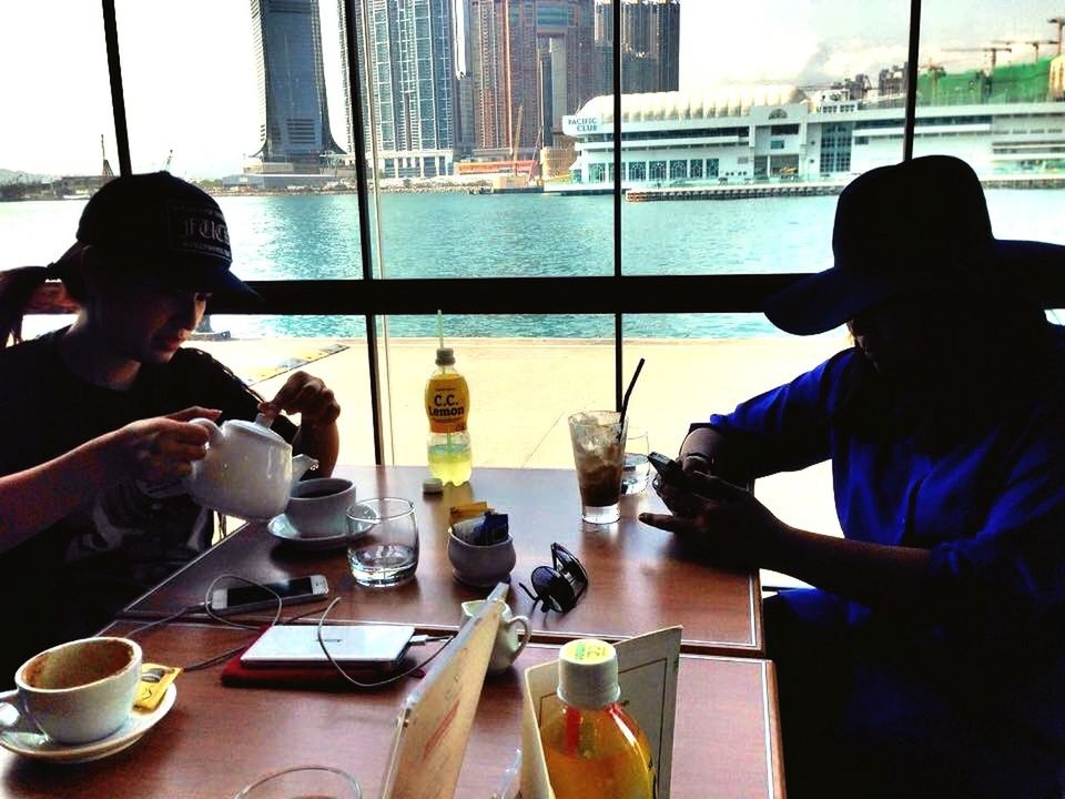 men, lifestyles, sitting, water, food and drink, leisure activity, table, restaurant, refreshment, person, drink, indoors, working, holding, standing, chair, nautical vessel