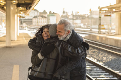 People greeting on train station platform