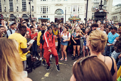 People standing on street in city