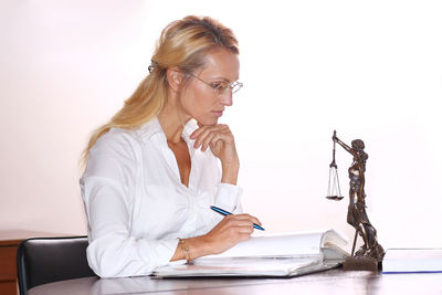 Young woman using laptop at home