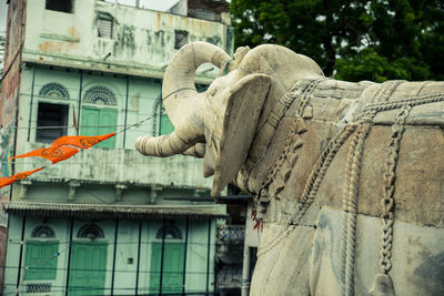 Elephant statue against historical building