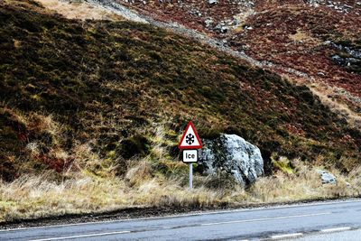 Road sign against clear sky