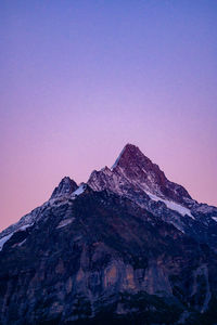 Low angle view of mountain range against clear sky