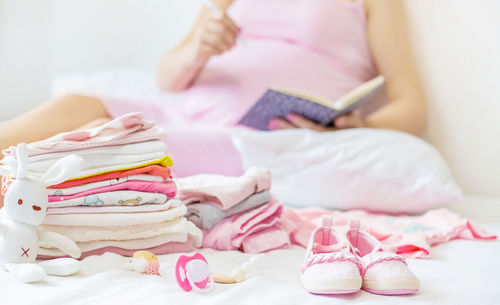 Baby clothing on bed at home