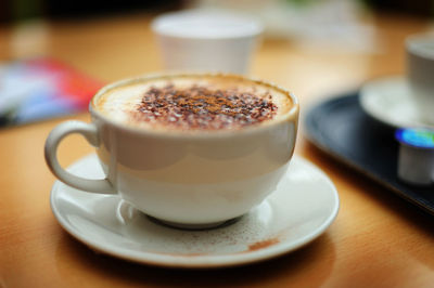 Still-life shot of a cup of coffee, shot with a narrow depth of field