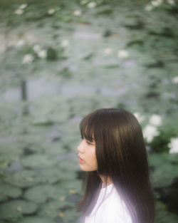 Portrait of a young woman standing outdoors