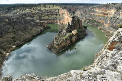 High angle view of lake amidst rock formation