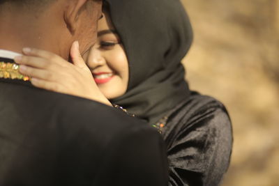 Close-up portrait of young couple