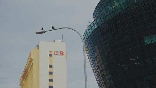 Low angle view of skyscrapers against sky