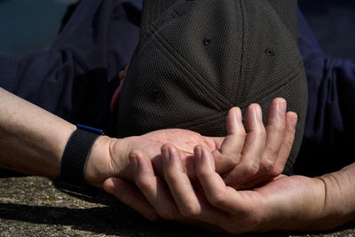 Close-up of people on hands