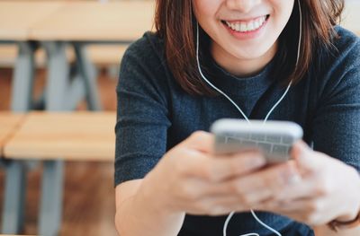 Close-up of woman using mobile phone