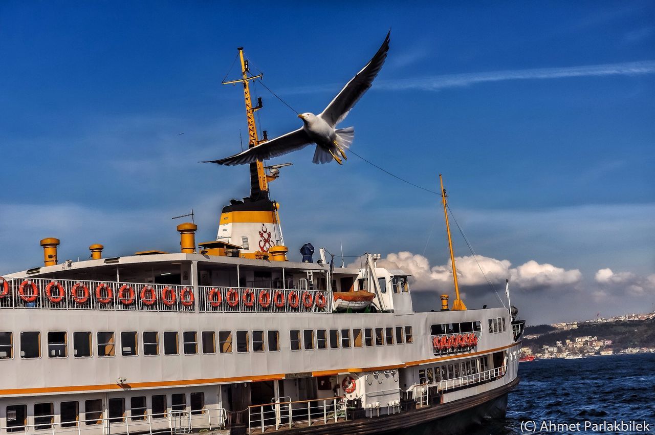 transportation, mode of transport, nautical vessel, crane - construction machinery, built structure, architecture, building exterior, sky, travel, crane, windmill, boat, alternative energy, day, mast, development, wind power, environmental conservation, harbor, outdoors