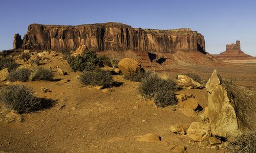 Rock formations in desert against clear sky