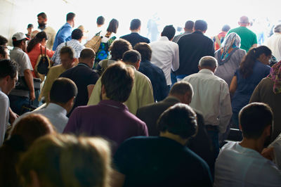 Rear view of people at music concert in city