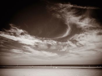 Scenic view of sea against cloudy sky