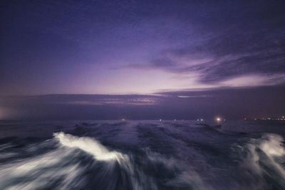 Scenic view of sea against clear sky at night