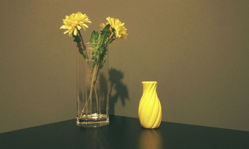 Close-up of yellow flower in vase on table