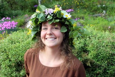 Portrait of smiling woman wearing flower headwear