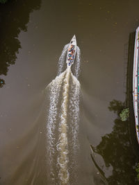 An aerial view of a fisherman boat going out fishing