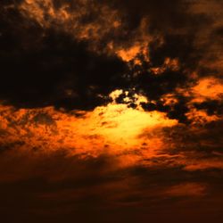 Low angle view of dramatic sky during sunset