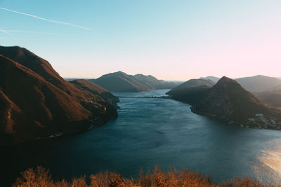 Scenic view of lake against sky during sunset