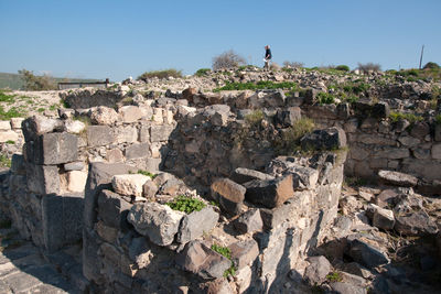 Full frame shot of rocks on rock against sky