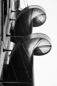 Low angle view of old machine part