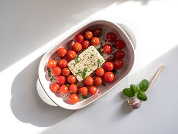 High angle view of strawberries in bowl on table
