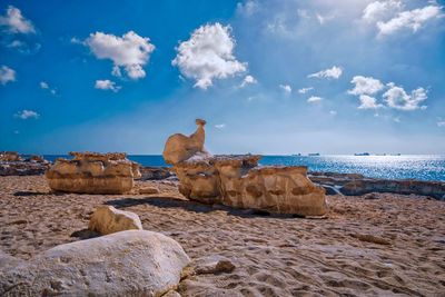 Scenic view of beach against sky