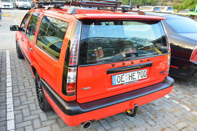 View of red car on road