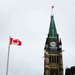 Low angle view of clock tower against clear sky