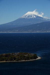 Scenic view of sea against blue sky