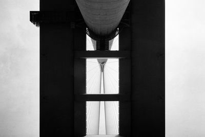 Low angle view of illuminated lamp against building