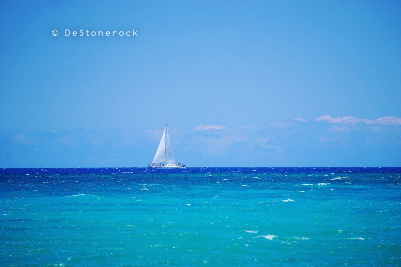 sea, blue, horizon over water, nautical vessel, water, sailboat, transportation, waterfront, mode of transport, scenics, sky, tranquil scene, tranquility, nature, journey, rippled, sailing, seascape, beauty in nature, outdoors, day, cloud, non-urban scene, vibrant color, ocean, no people, distant